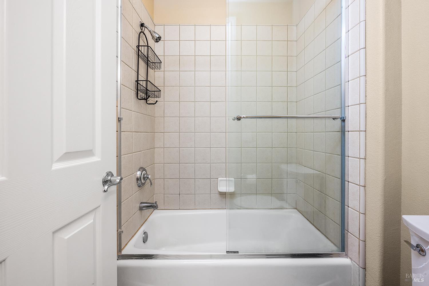 3696 Newbury Court Santa Rosa, CA 95404 - Photo 41 of 79 a white bath tub sitting next to a white sink and vanity