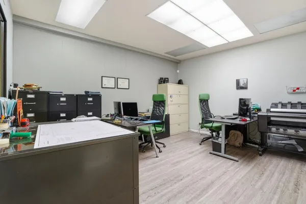 a workspace with furniture and bathroom