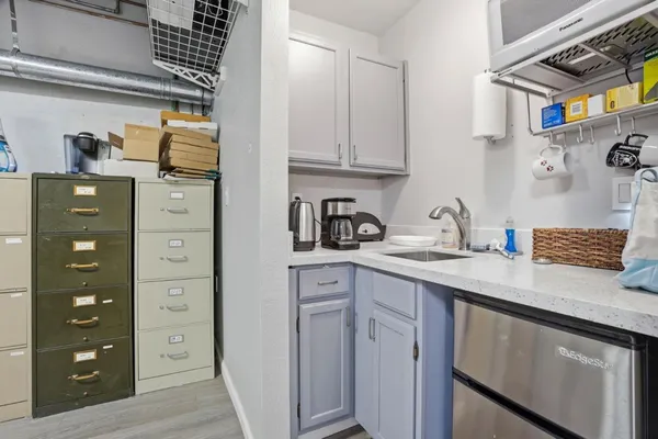 a close view of two chairs and a refrigerator
