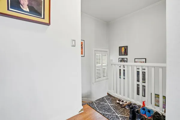 a view of an entryway with wooden floor