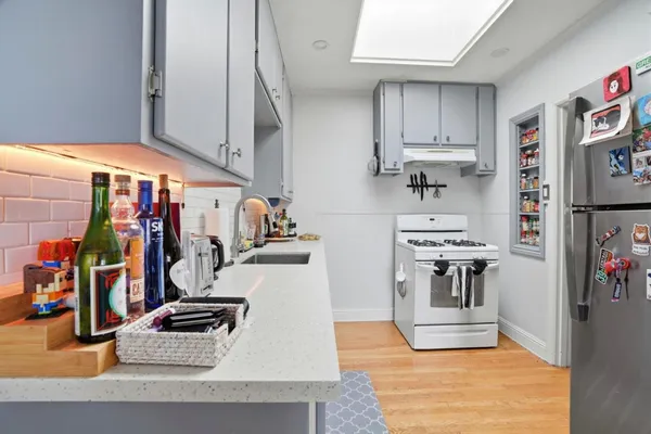 a view of a kitchen with appliances and cabinets