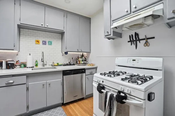 a kitchen with cabinets and appliances