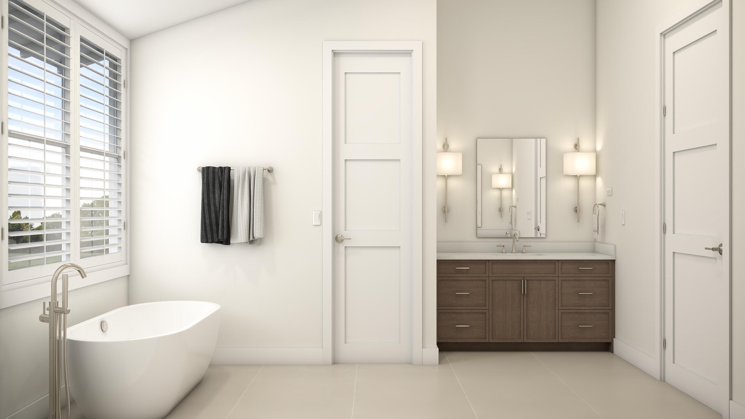 135 Kings Lane Fort Pierce, FL 34950 - Photo 25 of 67 a spacious bathroom with a double vanity sink a mirror and a bathtub