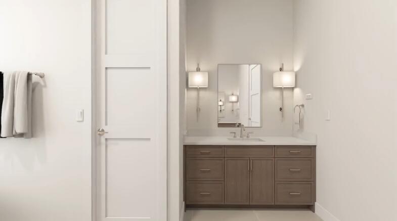 135 Kings Lane Fort Pierce, FL 34950 - Photo 26 of 67 a bathroom with a granite countertop sink and a mirror