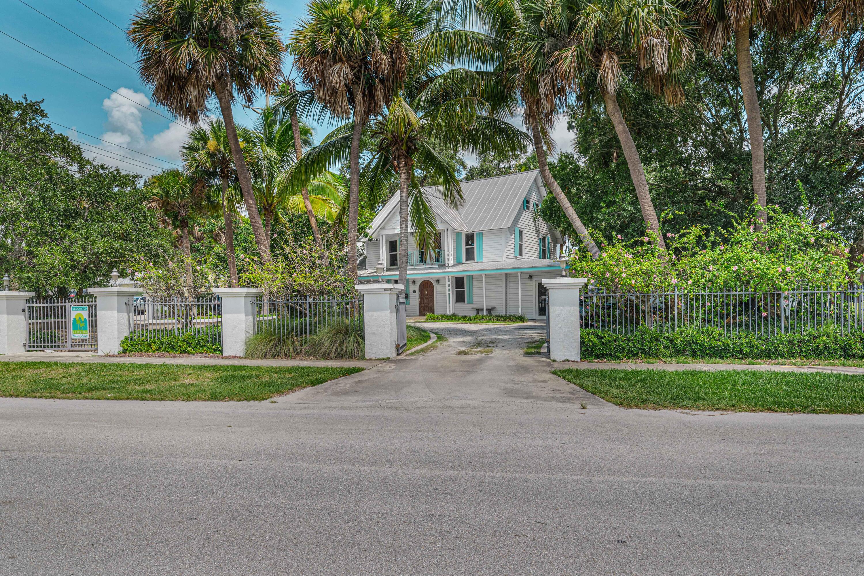 135 Kings Lane Fort Pierce, FL 34950 - Photo 42 of 67 a view of a house with a yard and large trees