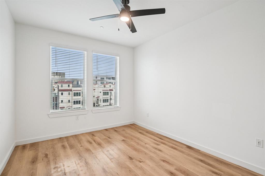 2016 South Ervay Street, Unit B1 Dallas, TX 75215 - Photo 12 of 35 Empty room with light wood-type flooring and a ceiling fan