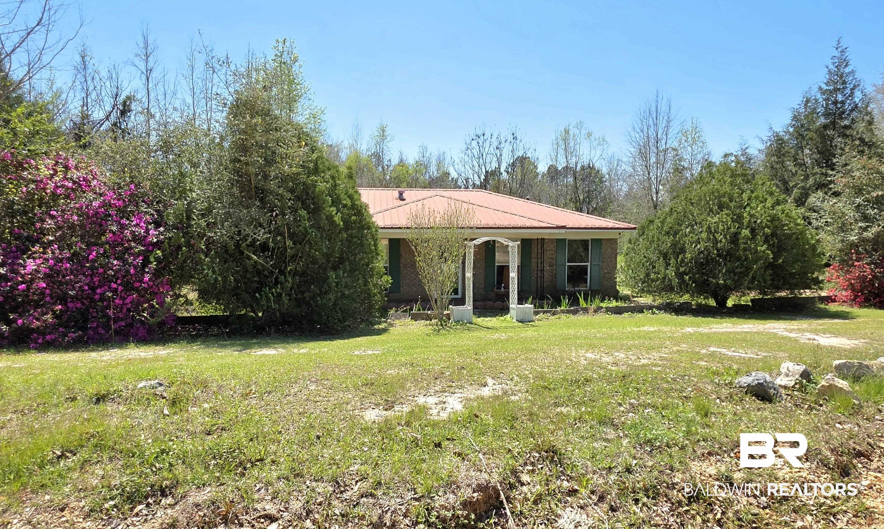 11 Coal Fire Road Jackson, AL 36545 - Photo 5 of 23 Rear view of property featuring a yard and covered porch