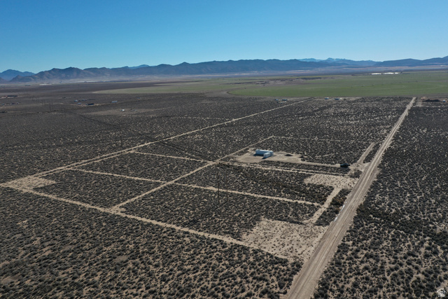 265 South 700 East Beryl, UT 84714 - Photo 6 of 10 Aerial view of property's location with a mountain backdrop and rural landscape