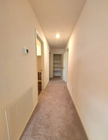 a view of hallway with stairs