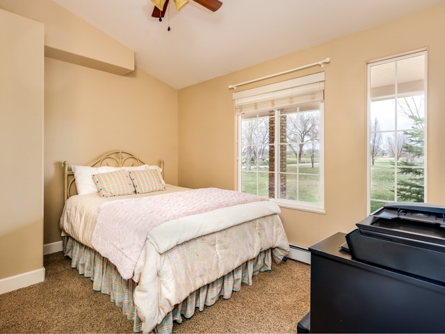 1677 L Road Fruita, CO 81521 - Photo 17 of 42 a bedroom with a bed and a window