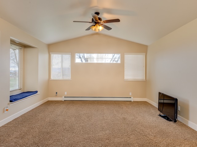 1677 L Road Fruita, CO 81521 - Photo 26 of 42 an empty room with windows and fan