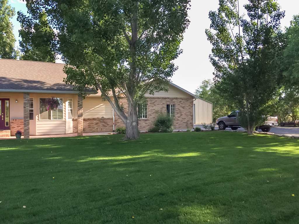 1677 L Road Fruita, CO 81521 - Photo 34 of 42 a front view of house with yard and green space