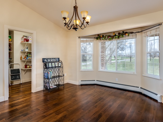 1677 L Road Fruita, CO 81521 - Photo 6 of 42 a view of an empty room with wooden floor and a window