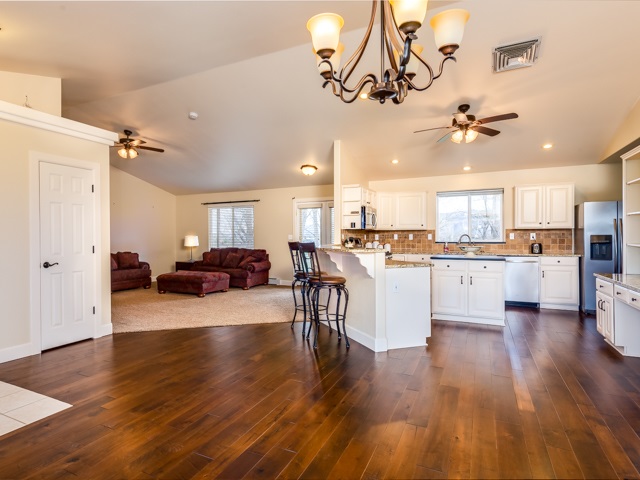1677 L Road Fruita, CO 81521 - Photo 8 of 42 a view of kitchen and living room with wooden floor