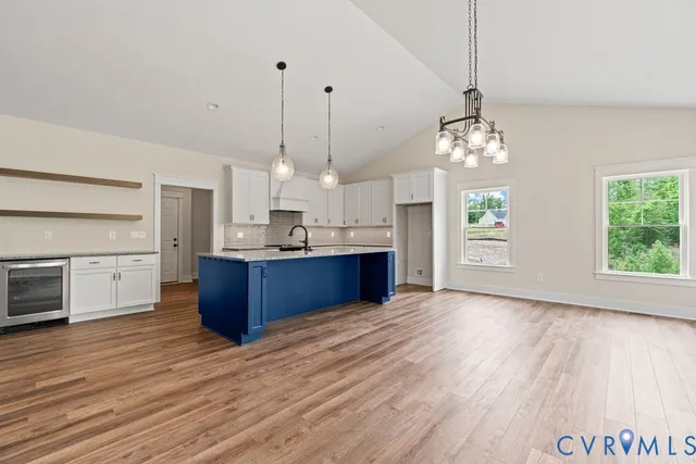 a view of kitchen and kitchen with microwave