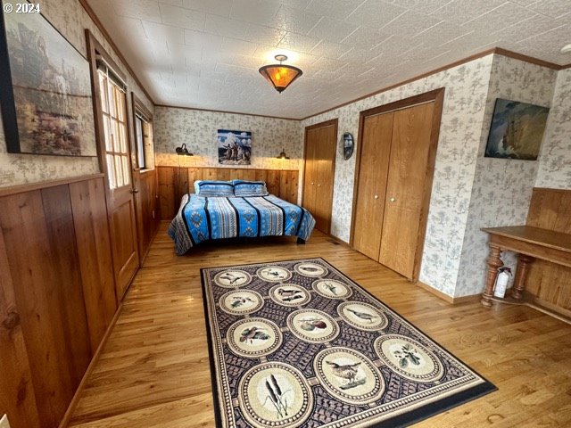 43174 Cupper Creek Road Kimberly, OR 97848 - Photo 11 of 48 a bedroom with furniture and a flat screen tv