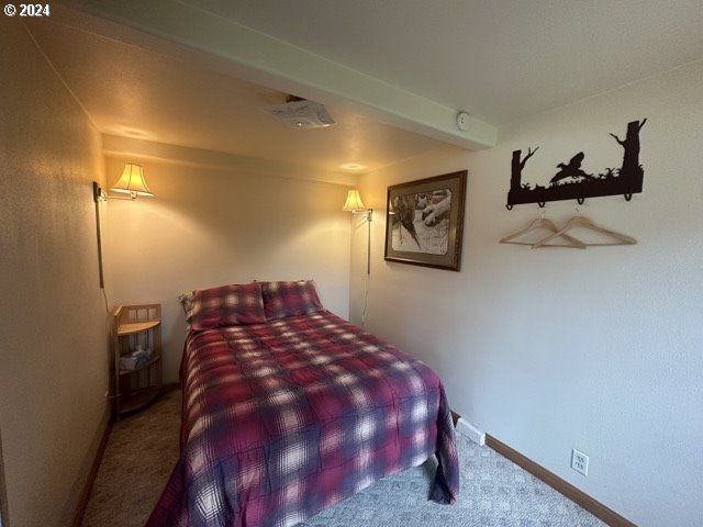 43174 Cupper Creek Road Kimberly, OR 97848 - Photo 18 of 48 a bed sitting in a bedroom next to a bathroom
