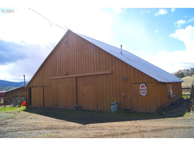 43174 Cupper Creek Road Kimberly, OR 97848 - Photo 29 of 48 a black and white building with trees in the background