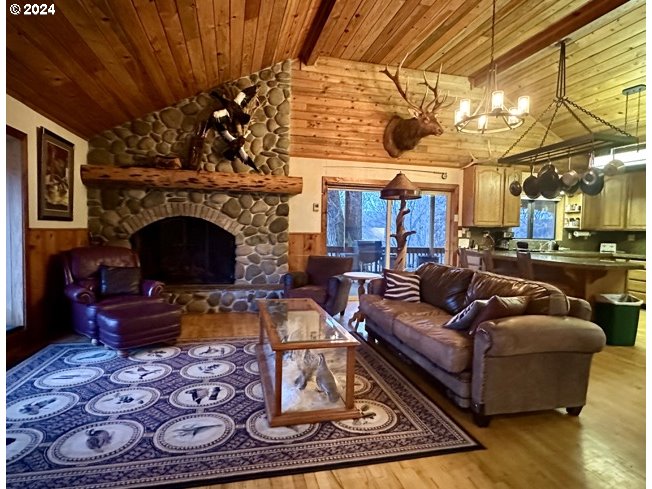 43174 Cupper Creek Road Kimberly, OR 97848 - Photo 5 of 48 a living room with furniture and a fireplace