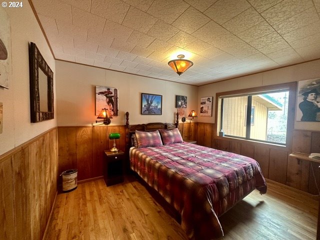 43174 Cupper Creek Road Kimberly, OR 97848 - Photo 10 of 48 a bedroom with a bed and a chandelier