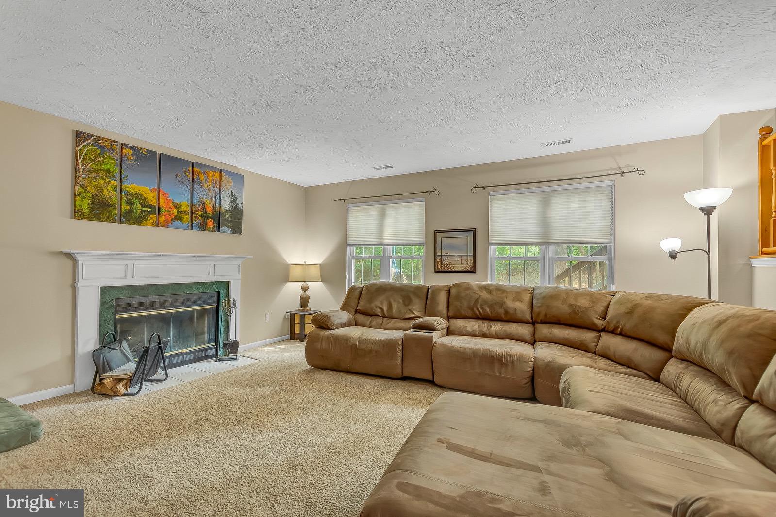 11144 Rawhide Road Lusby, MD 20657 - Photo 22 of 33 Living room with a fire place