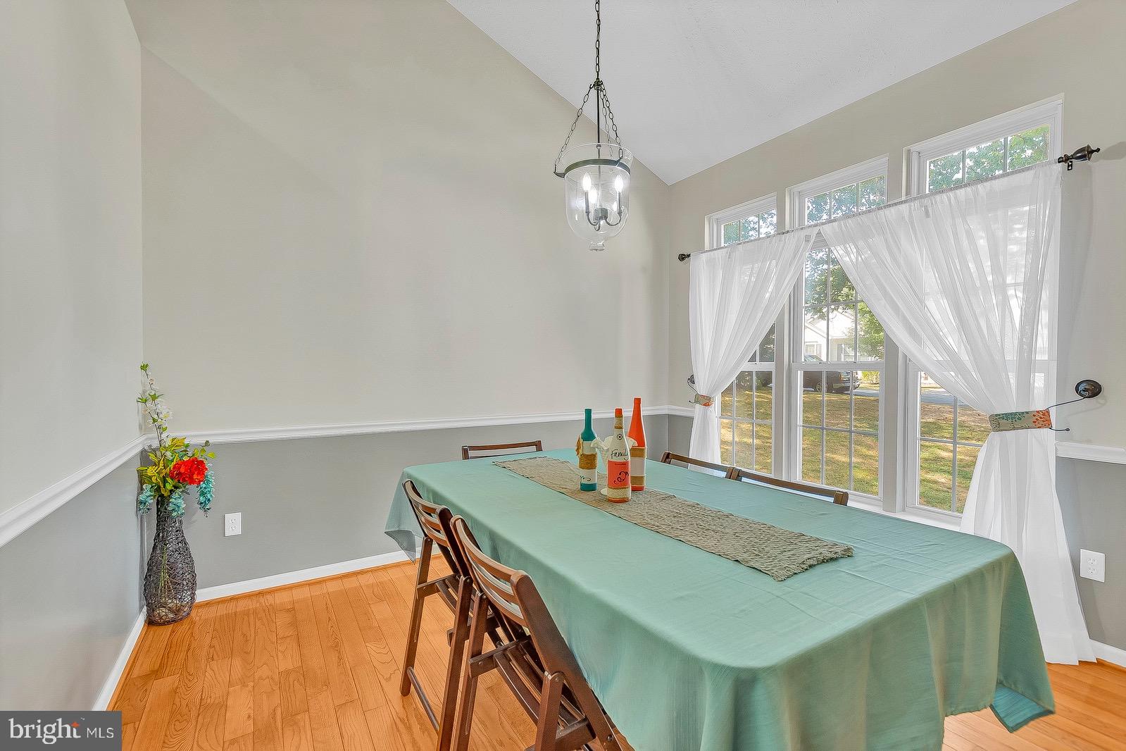 11144 Rawhide Road Lusby, MD 20657 - Photo 6 of 33 Formal dining area with cathedral ceilings