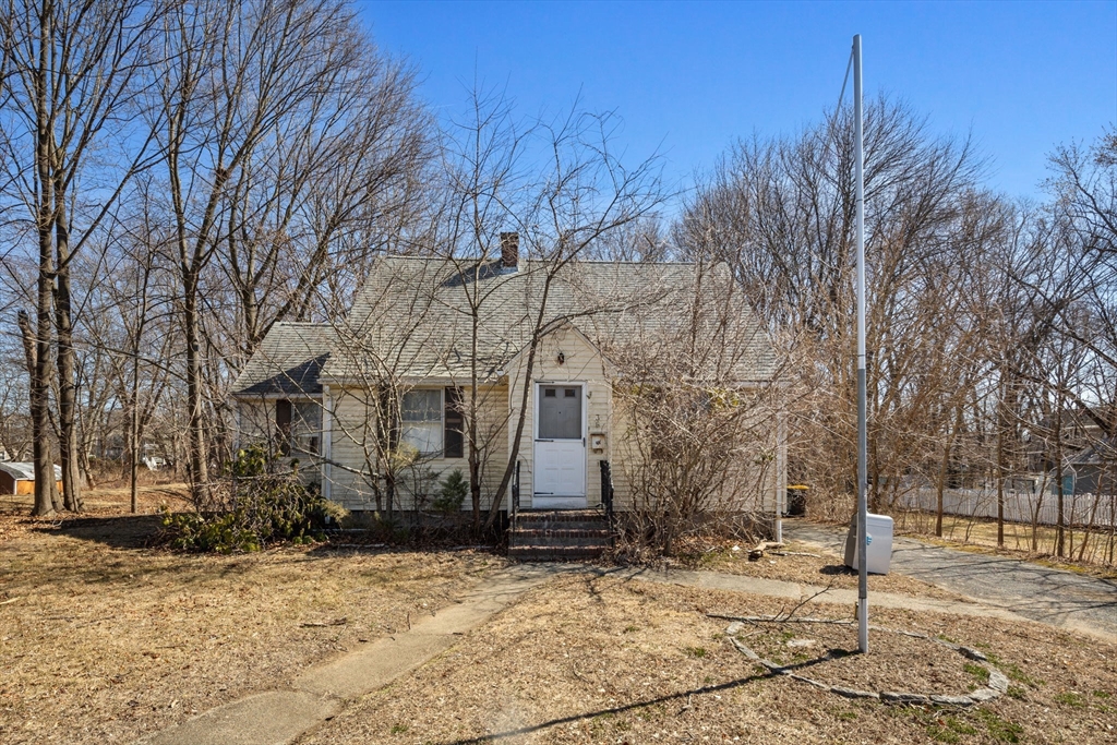 36 Summit Street Framingham, MA 01702 - Photo 1 of 24 a front view of a house with a yard