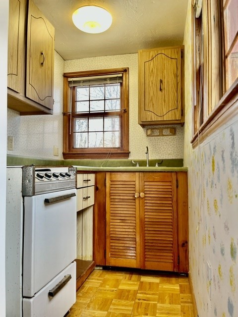 36 Summit Street Framingham, MA 01702 - Photo 18 of 24 a view of a kitchen with stainless steel appliances granite countertop a sink and a window