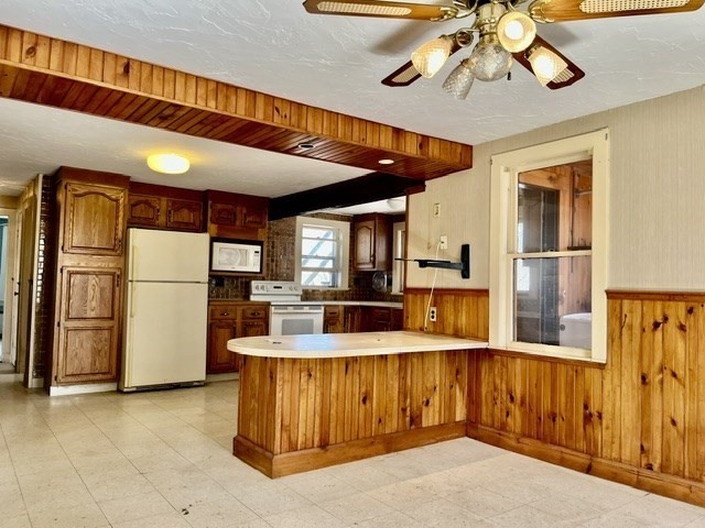 36 Summit Street Framingham, MA 01702 - Photo 4 of 24 a view of kitchen with furniture and refrigerator