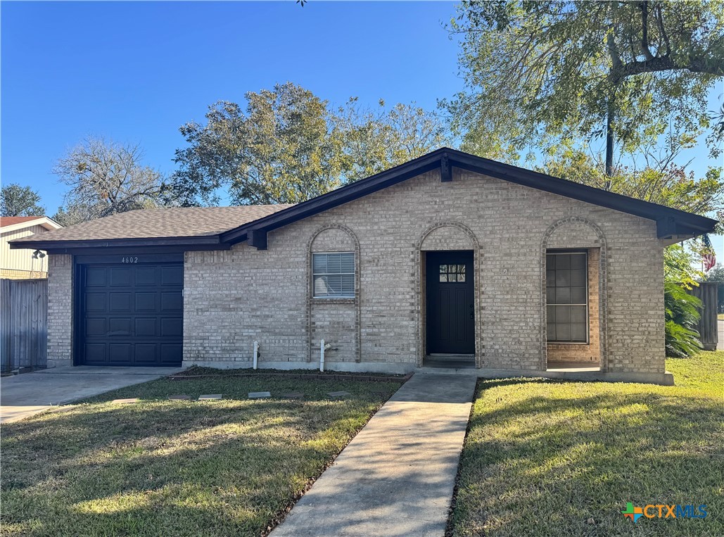 4602 Dahlia Lane Victoria, TX 77904 - Photo 1 of 16 a view of a house with a small yard