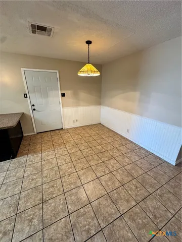 a kitchen with stainless steel appliances a stove a sink and a refrigerator