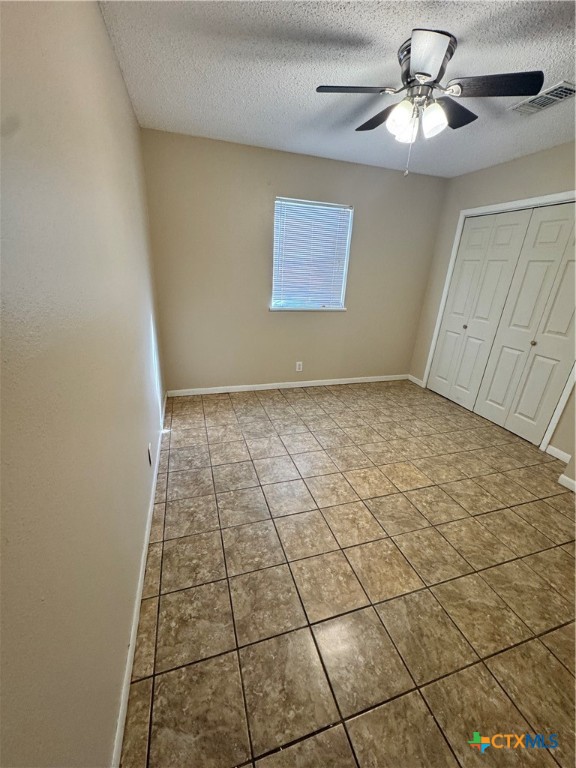 4602 Dahlia Lane Victoria, TX 77904 - Photo 10 of 16 a view of a livingroom with a ceiling fan and window