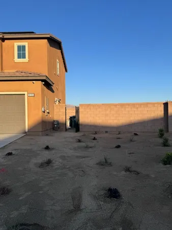 a view of a area with wooden fence