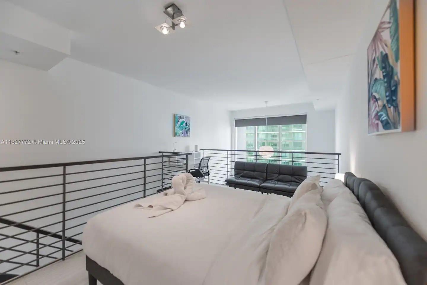Brickell Miami, FL 33130 - Photo 14 of 26 a bedroom with a bed and a large window