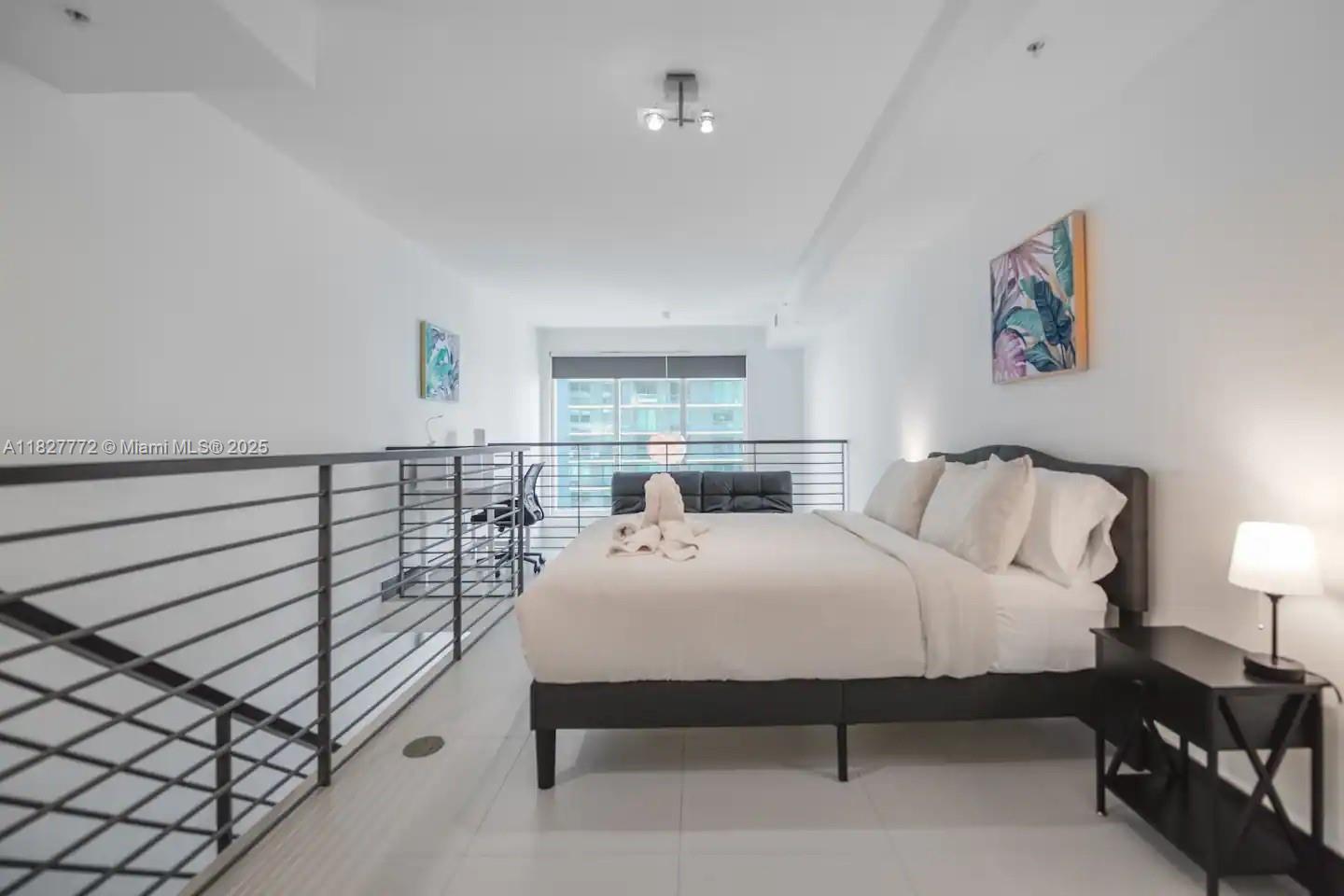 Brickell Miami, FL 33130 - Photo 15 of 26 a bedroom with a bed and window