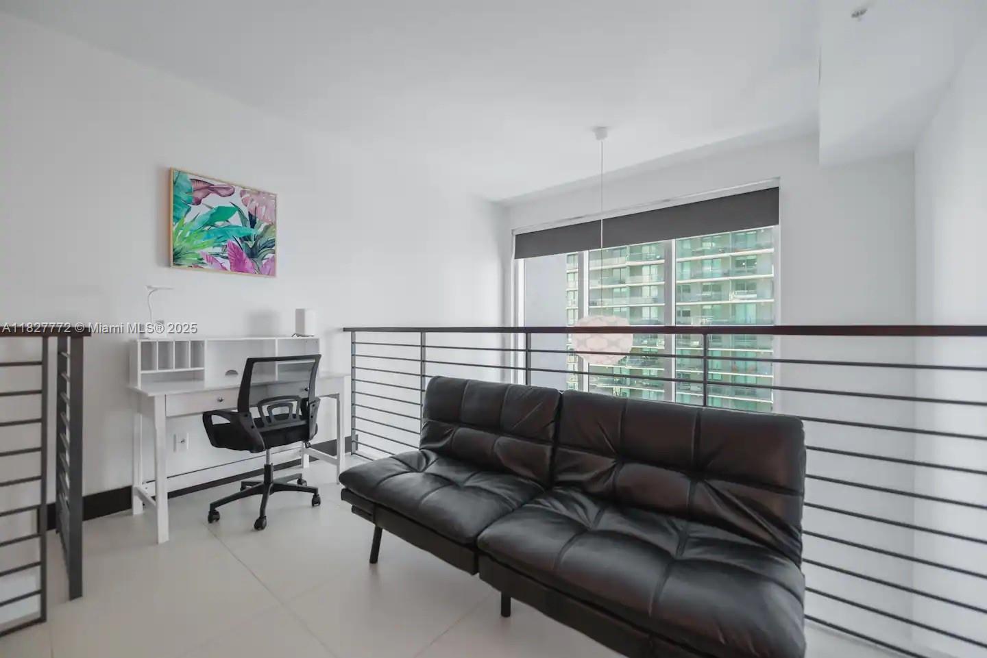 Brickell Miami, FL 33130 - Photo 17 of 26 a living room with furniture and a large window