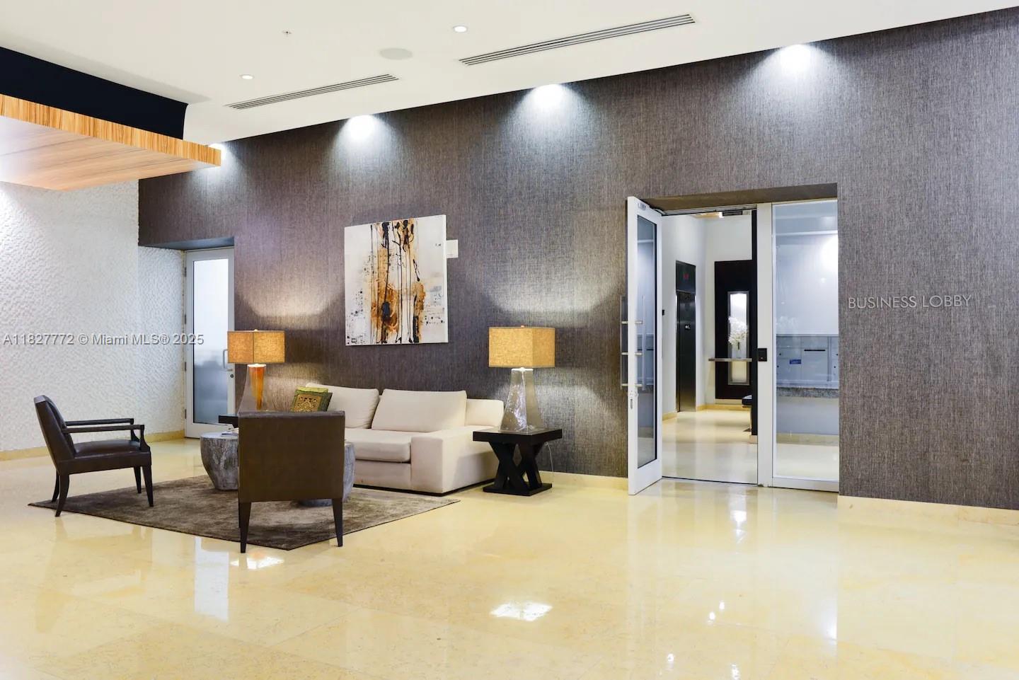 Brickell Miami, FL 33130 - Photo 25 of 26 a living room with furniture and a chandelier