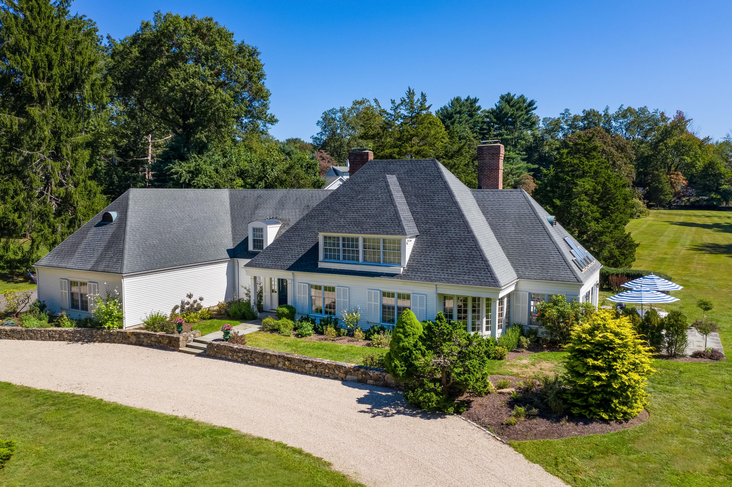 860 Hollow Tree Ridge Road Darien, CT 06820 - Photo 18 of 23 a aerial view of a house next to a yard