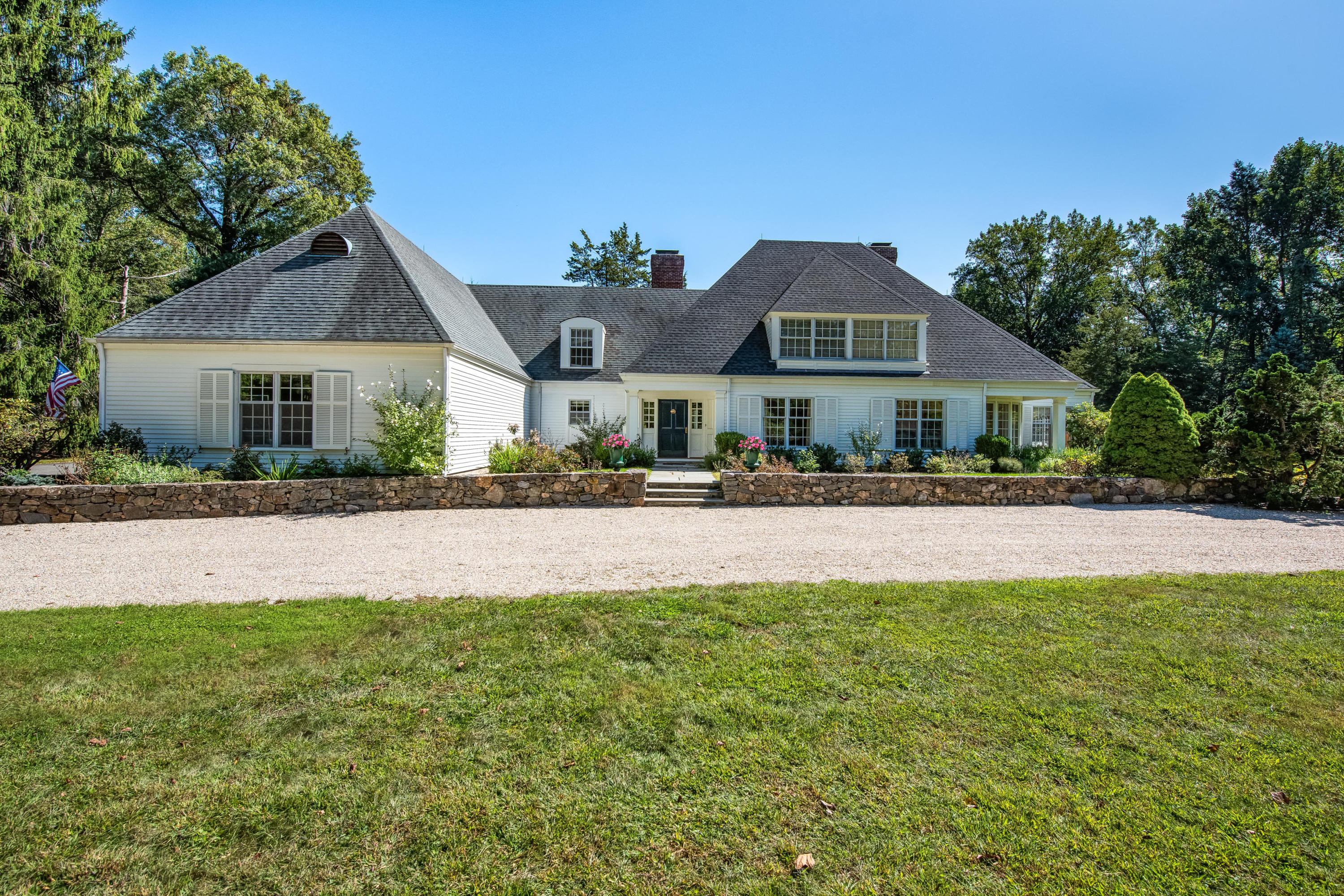 860 Hollow Tree Ridge Road Darien, CT 06820 - Photo 3 of 23 a front view of a house with a yard