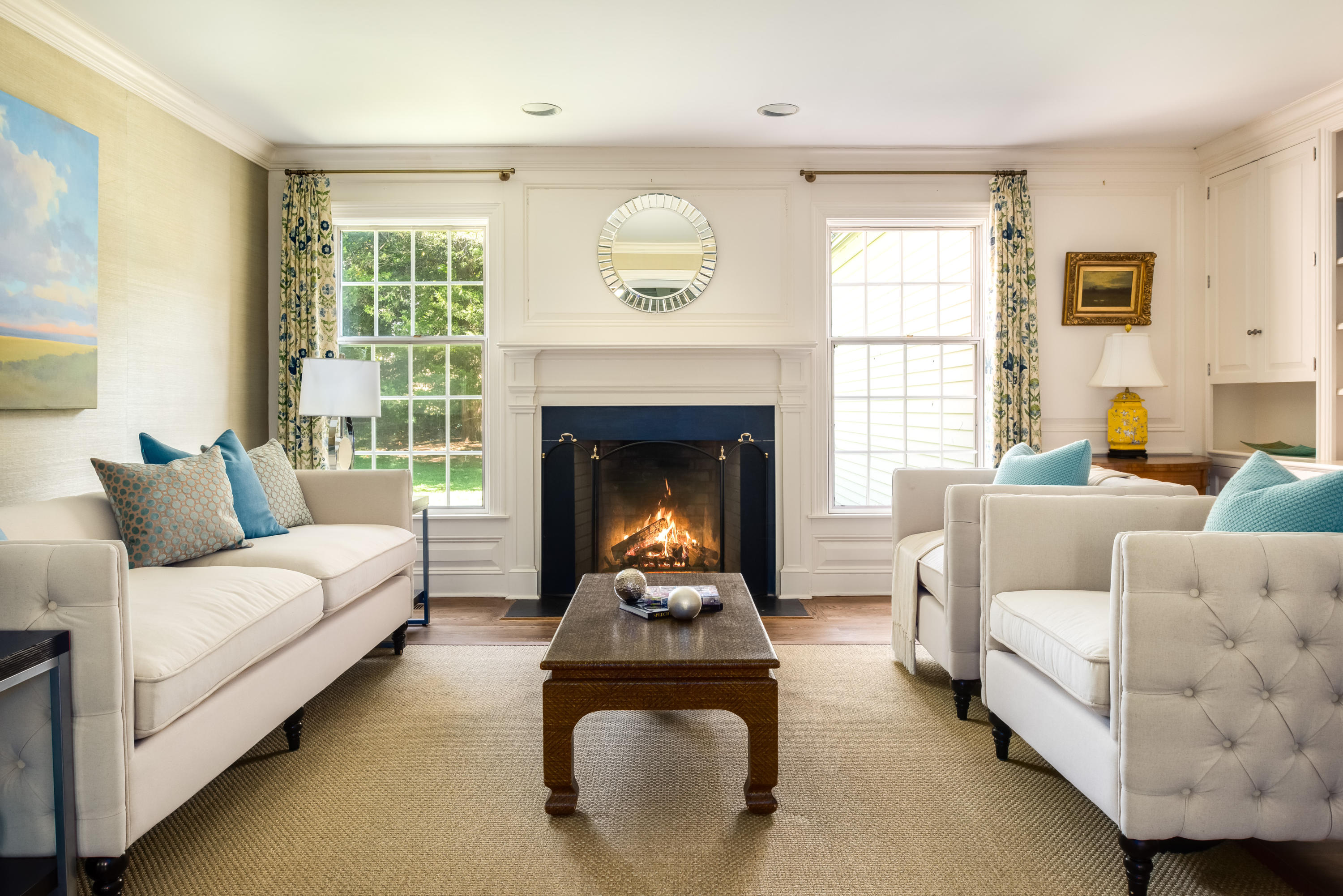 860 Hollow Tree Ridge Road Darien, CT 06820 - Photo 6 of 23 a living room with furniture and a fireplace