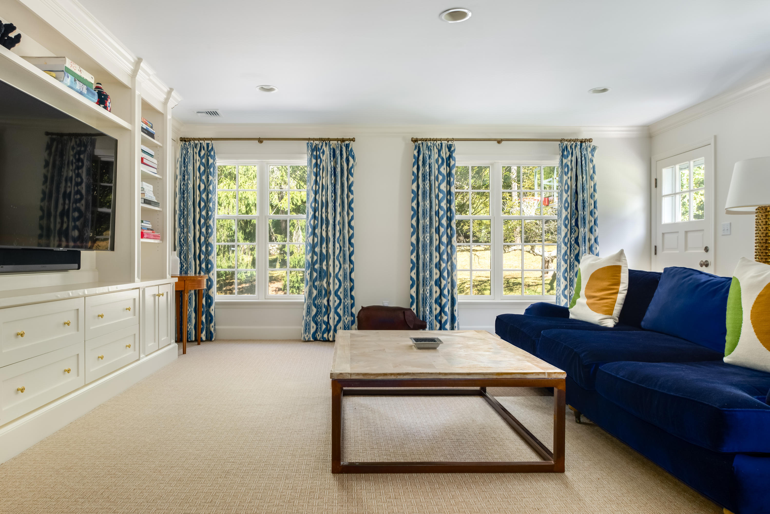 860 Hollow Tree Ridge Road Darien, CT 06820 - Photo 7 of 23 a living room with furniture and a flat screen tv