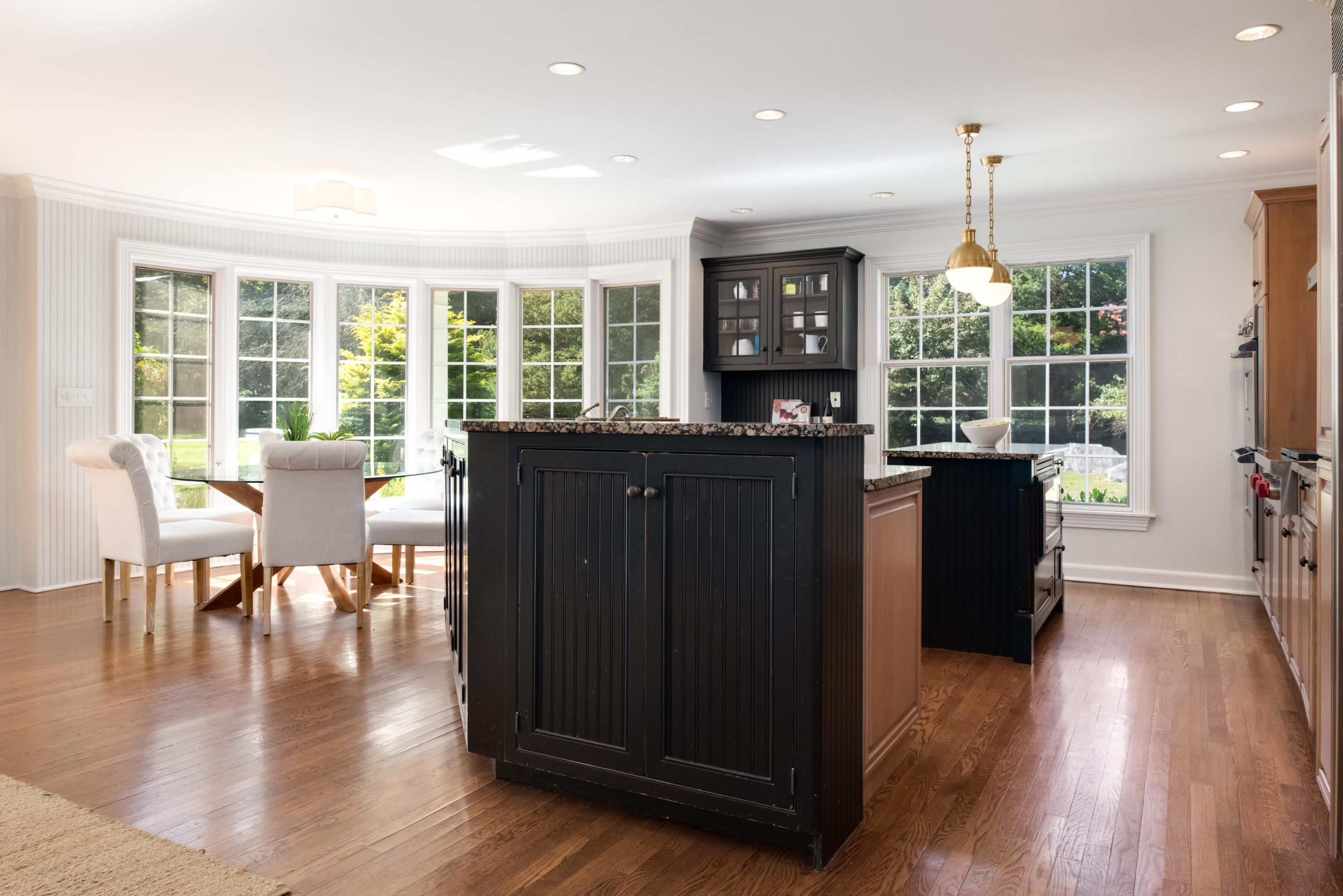 860 Hollow Tree Ridge Road Darien, CT 06820 - Photo 8 of 23 a view of a dining room with furniture window and wooden floor