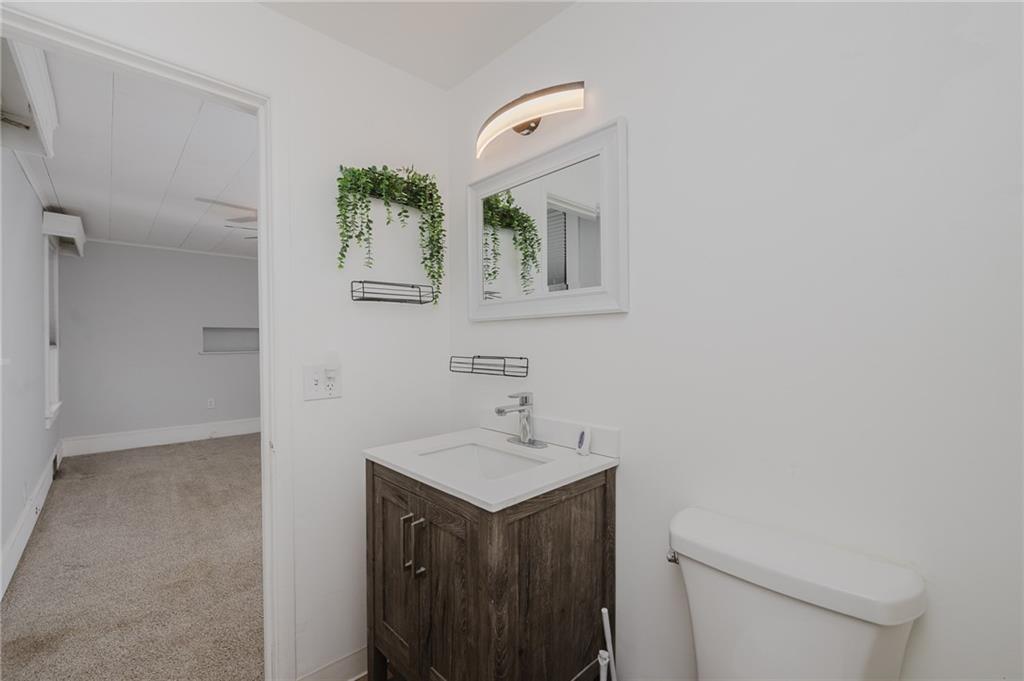 933 Oak Street Indiana, PA 15701 - Photo 14 of 28 a bathroom with a sink a toilet and mirror