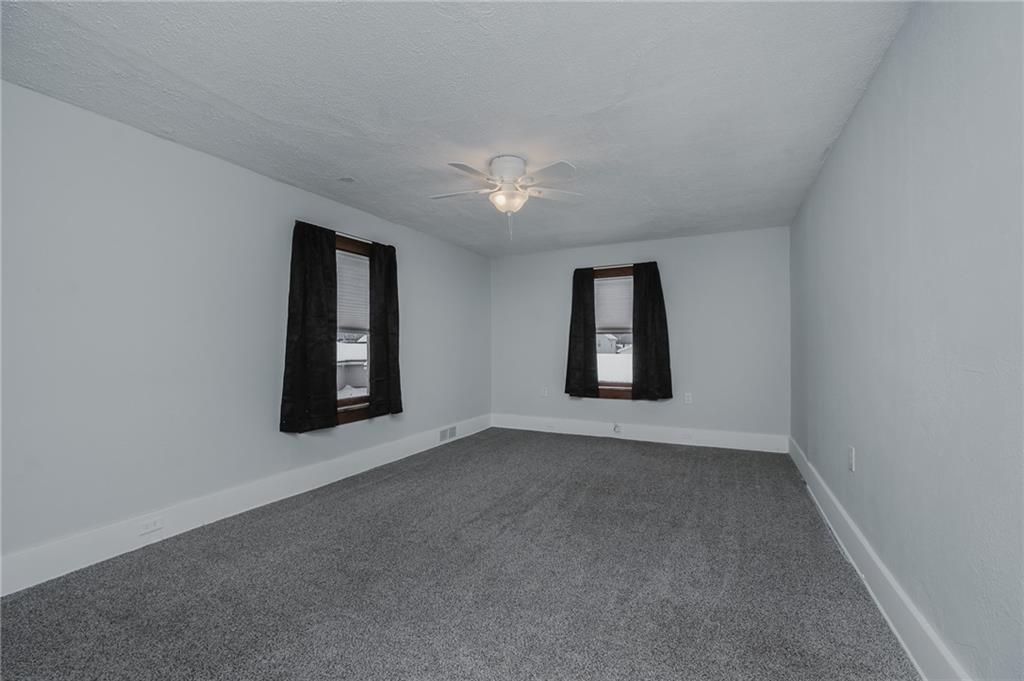 933 Oak Street Indiana, PA 15701 - Photo 18 of 28 an empty room with windows and ceiling fan