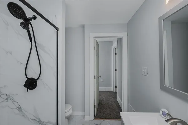 a view of a bathroom from a hallway