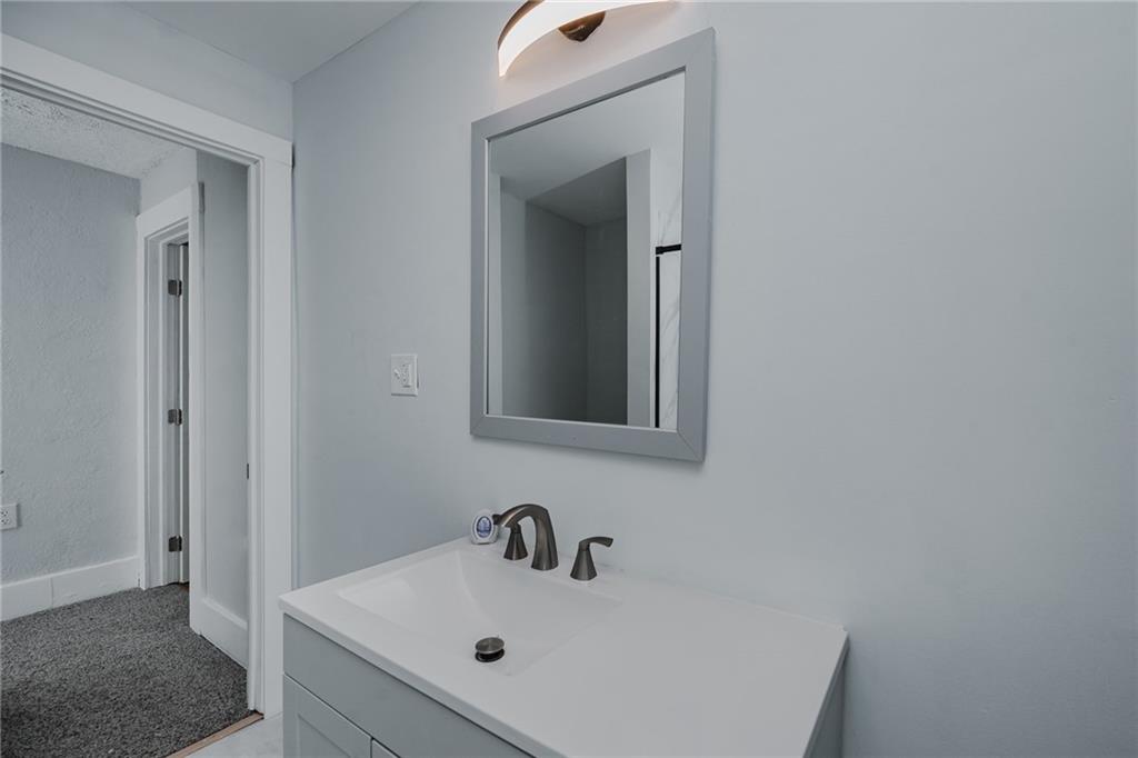 933 Oak Street Indiana, PA 15701 - Photo 22 of 28 a bathroom with a sink and a mirror