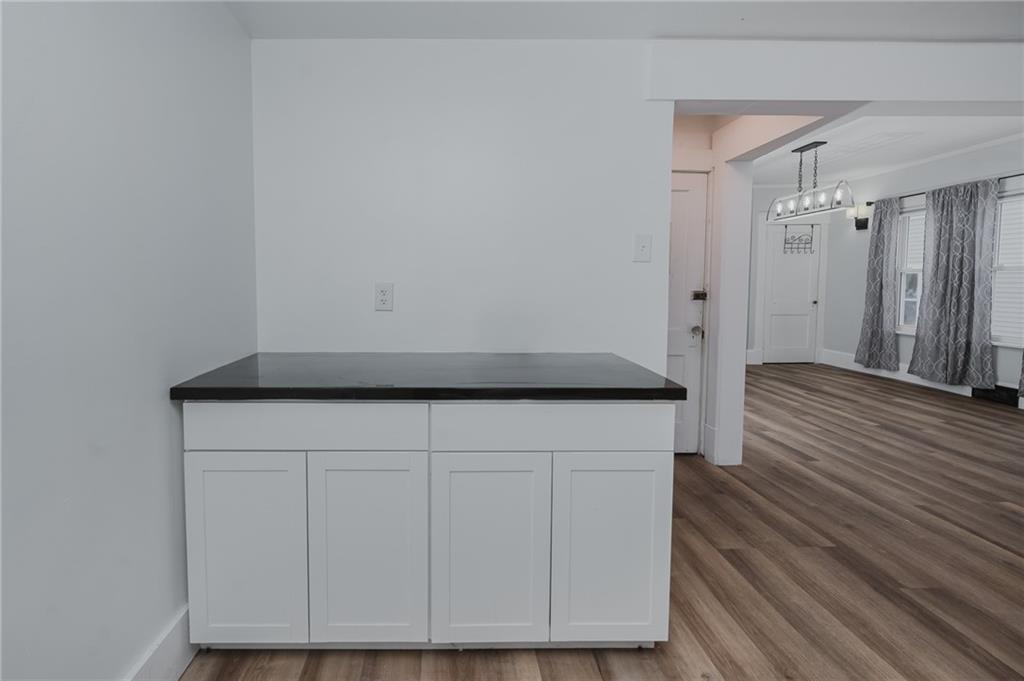 933 Oak Street Indiana, PA 15701 - Photo 7 of 28 a view of storage and utility room with wooden floor