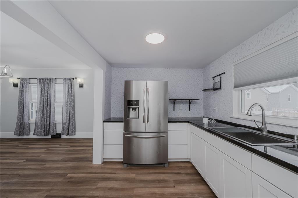 933 Oak Street Indiana, PA 15701 - Photo 9 of 28 a kitchen with stainless steel appliances granite countertop a sink a refrigerator and a stove