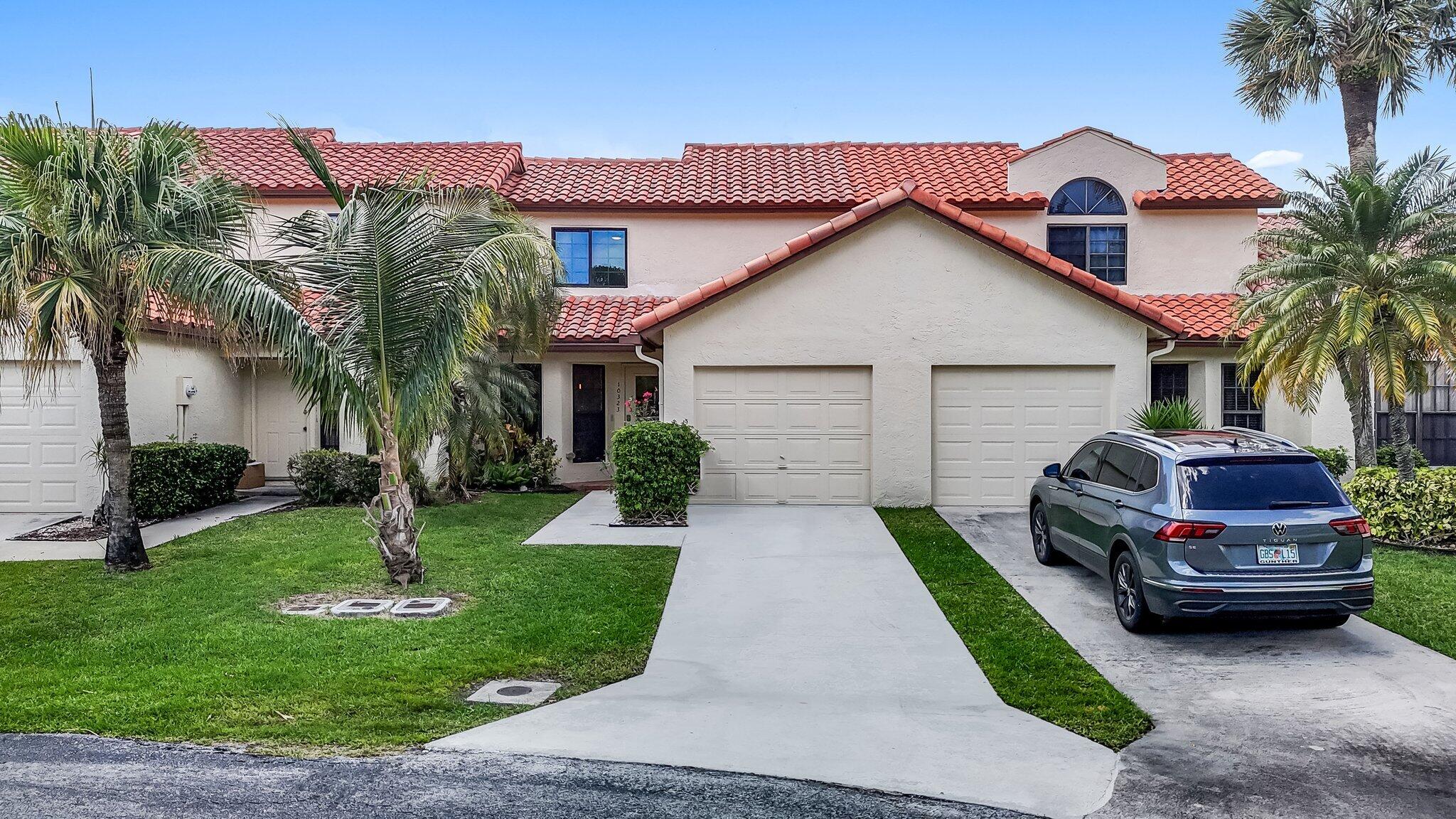 10323 Hidden Springs Court Boca Raton, FL 33498 - Photo 28 of 41 a front view of a house with garden