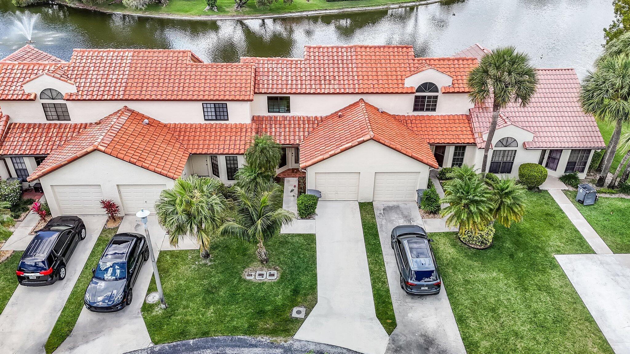 10323 Hidden Springs Court Boca Raton, FL 33498 - Photo 29 of 41 an aerial view of multiple houses with yard